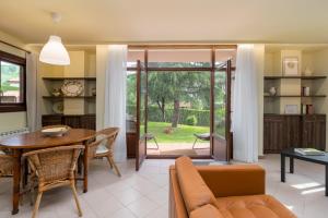 a living room with a couch and a table at Casa Velasco in Esles