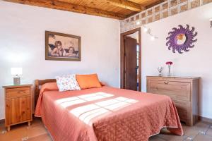 a bedroom with a bed and a mirror on the wall at Villa Giovanni in Barbate +26 photos