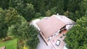 an overhead view of a large house with a red roof at B&B Tre Faggi in Borgo