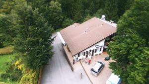an overhead view of a building with a car parked at B&B Tre Faggi in Borgo