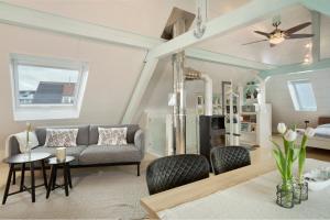 a living room with a couch and a table at Ferienappartement Pauli in Hagnau
