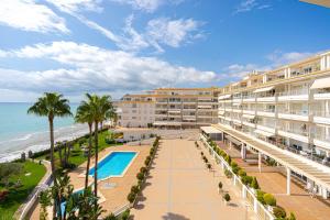 an aerial view of a resort with a swimming pool and the ocean at Costabella Altea in Altea