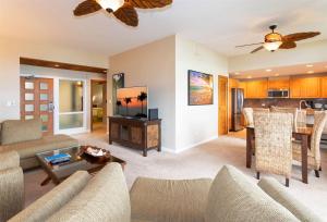 a living room with a couch and a table at 2914 Ridge in Kahana