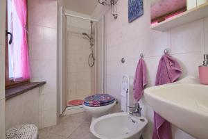 a bathroom with a toilet and a sink and a shower at La Nicchia in Tirli +20 photos