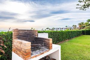 a brick fireplace in the backyard of a house at Casa Vesalia in Vinarós