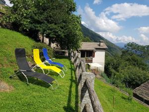 a group of chairs sitting on top of a hill at Casa Grande in Falmenta
