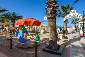 a playground on the beach with a pirate ship at Sole Apartment in Rimini