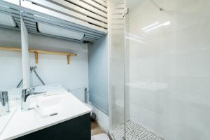 a bathroom with a sink and a shower at Studio Barèges ski, rando, cure in Barèges +11 photos