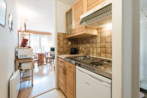 a kitchen with a sink and a stove top oven at Studio Barèges ski, rando, cure in Barèges