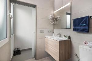 a bathroom with a sink and a mirror at Casa Mara 1 in Playa Quemada +14 photos