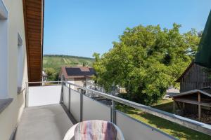 a balcony with a view of a tree at Wein- Und Obstbau Rupp in Obersulm