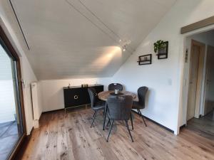 a dining room with a table and chairs at Ferienwohnung Andreas in St. Blasien