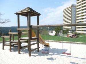 a wooden playground with a slide and a gazebo at Panoramablick über den Oberharz in Braunlage