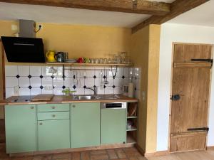 a kitchen with a sink and a counter top at Ferienwohnung Filser in Unterammergau