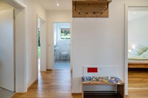a room with a bedroom and a bed and a mirror at Tanne in Ravensburg