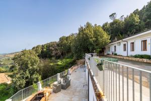 a view of a balcony of a building with trees at Casa Jerzu S'essia de su santu in Jerzu