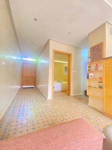 an empty room with a hallway with a bathroom at Mirage House in Mirleft