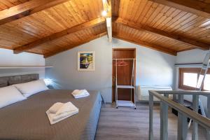 a bedroom with a bed and a wooden ceiling at Kate House in Ágios Matthaíos