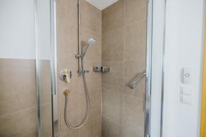 a bathroom with a shower with a glass door at Maso Fallmerayer - Fallmerayerhof in Bressanone +32 photos