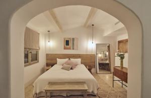 a bedroom with a large bed and a mirror at Casa Penisula in Porto-Vecchio +23 photos