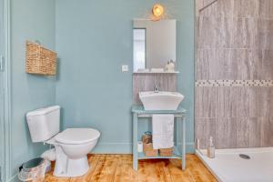 a bathroom with a toilet and a sink at Trois Clés Apartment 1 - 1 bed in Eymet +14 photos
