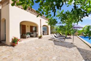 an external view of a villa with a swimming pool at Cas Cans in Artá