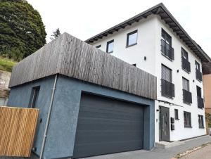 a building with a large garage door in front of it at Schiller´s Urban Escape in Freudenstadt