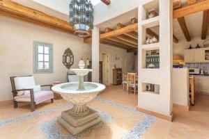 a living room with a fountain in the middle of a room at Oasis San Martin El Cotillo in El Cotillo