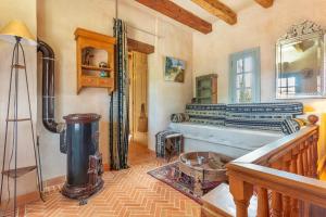 a living room with a stove in the corner of a room at Oasis San Martin El Cotillo in El Cotillo +37 photos