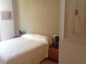 a bedroom with a white bed and two lamps at La Azohía Espacio en Calma in La Azohía +21 photos