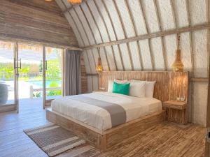 a bedroom with a large bed in a room at Gili Air Escape - Adults Only in Gili Islands