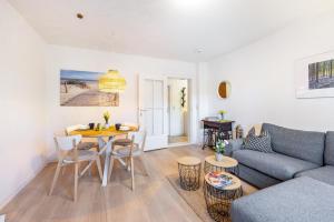 a living room with a couch and a table at Wohnung Horsti in Timmendorfer Strand