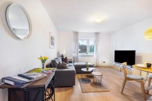 a living room with a couch and a table at Wohnung Horsti in Timmendorfer Strand