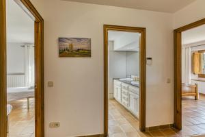 a bathroom with a sink and a mirror at Mas Cases in Girona +32 photos