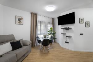 a living room with a couch and a table at Apartamento Calecampo in Candelaria