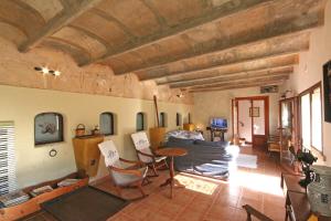 a living room with a couch and a table at S'hort des Cura in Islas Baleares