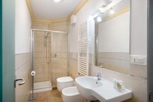 a bathroom with a sink and a toilet and a shower at Buddha, borgo dei pescatori in Cervo +13 photos