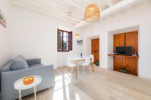 a living room with a couch and a table at Son Crespi Vell in Manacor