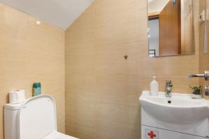 a bathroom with a toilet and a sink at Tour House in Rio Tinto +18 photos