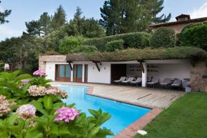 a house with a swimming pool in a yard at Gran Castanyer in Viladrau