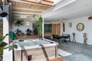 a jacuzzi tub in the living room of a house at El Alcaidón in Tías