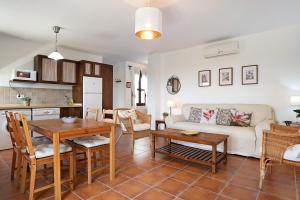 a living room with a couch and a table at Cobijadas75 Corredera in Vejer de la Frontera +18 photos