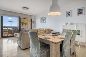 a dining room with a table and chairs at Gadea Vistas in Caserío Capnegret