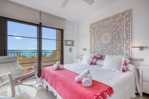 a bedroom with a bed and a chair and a window at Gadea Vistas in Caserío Capnegret +30 photos