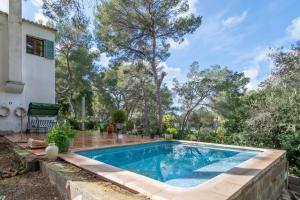 a swimming pool in the backyard of a house at Son Oliver in Palma de Mallorca