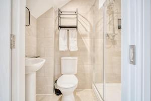a bathroom with a toilet and a sink and a shower at The Stuart Hotel in Liverpool +31 photos