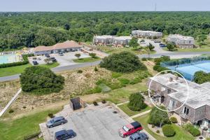 an aerial view of a house with a pool at Sandy Bottom VROBX in Kitty Hawk