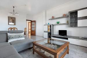 a living room with a couch and a coffee table at Jalón de Cameros in Tacoronte