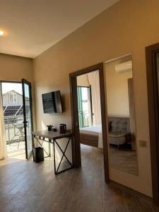 a room with a mirror and a table and a bed at Yerevan Street hotel in Yerevan