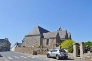 a car parked in front of a stone building at Chambre De Convenant Hery Bihan in Coatreven +2 photos